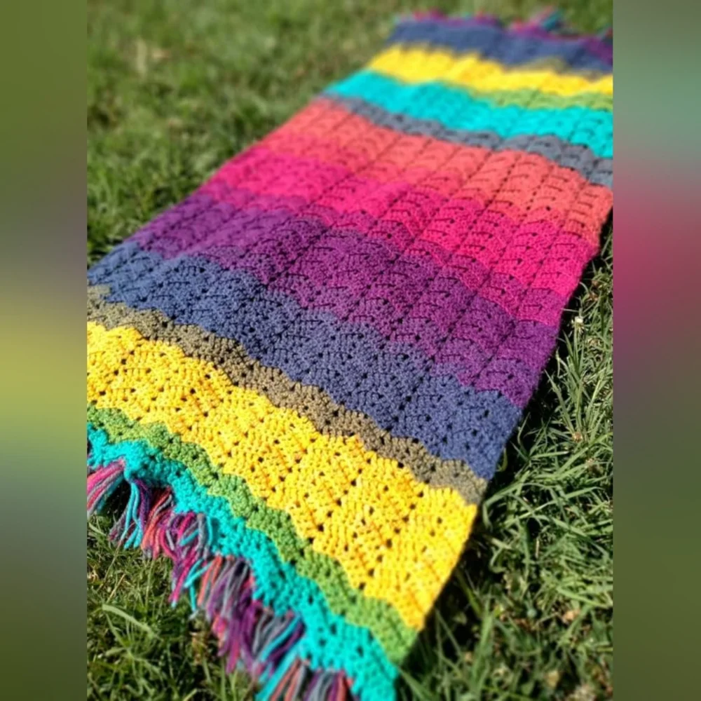 Handcrafted rainbow blanket with fringe