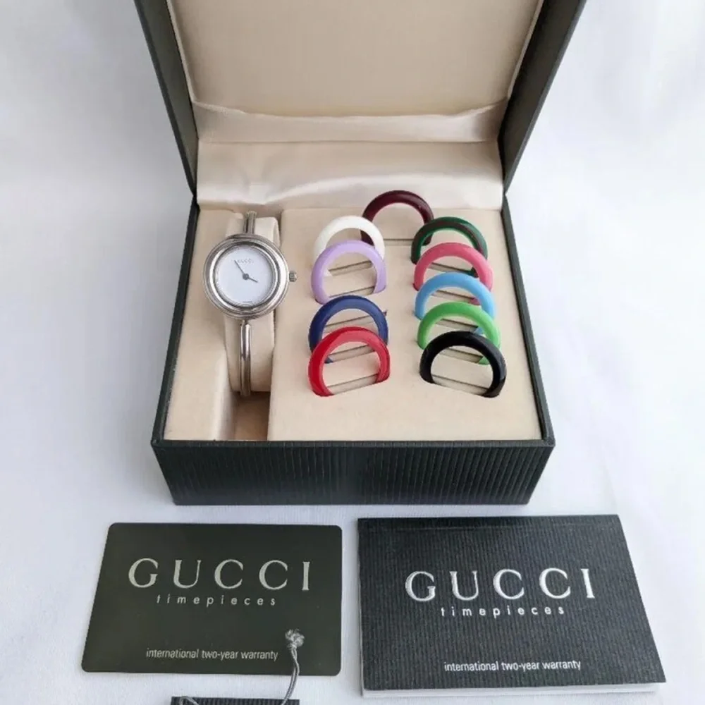 GUCCI Silver Italian Luxury Bracelet Watch with Bezels for changing