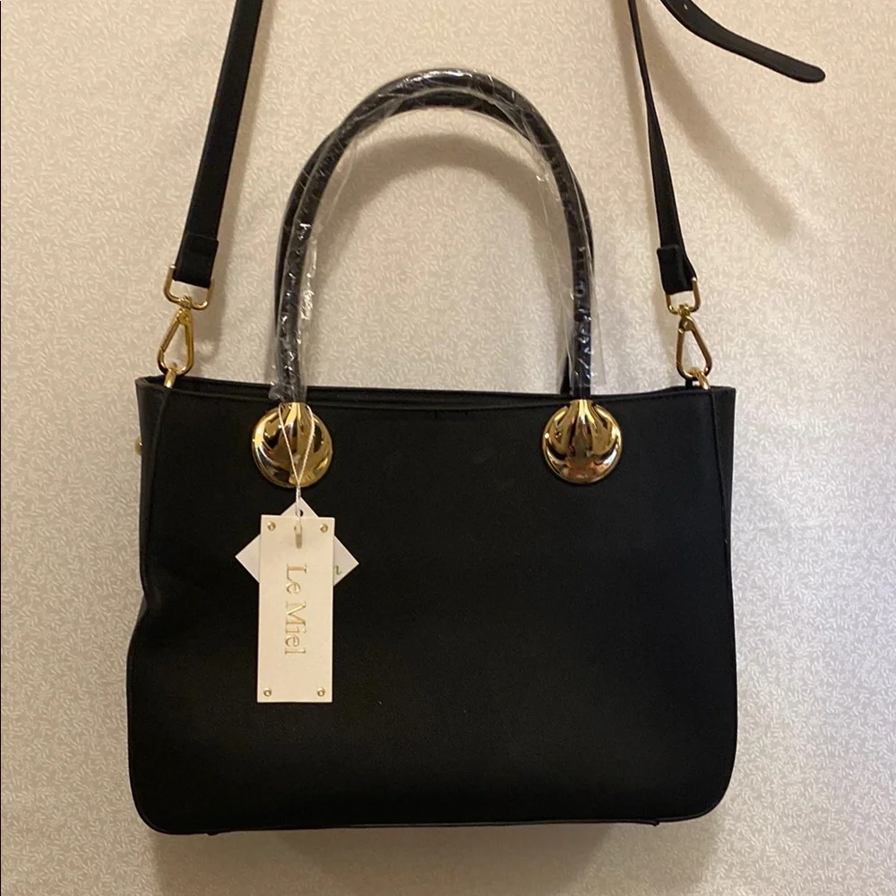 Elegant Black Handbag with Gold Accents