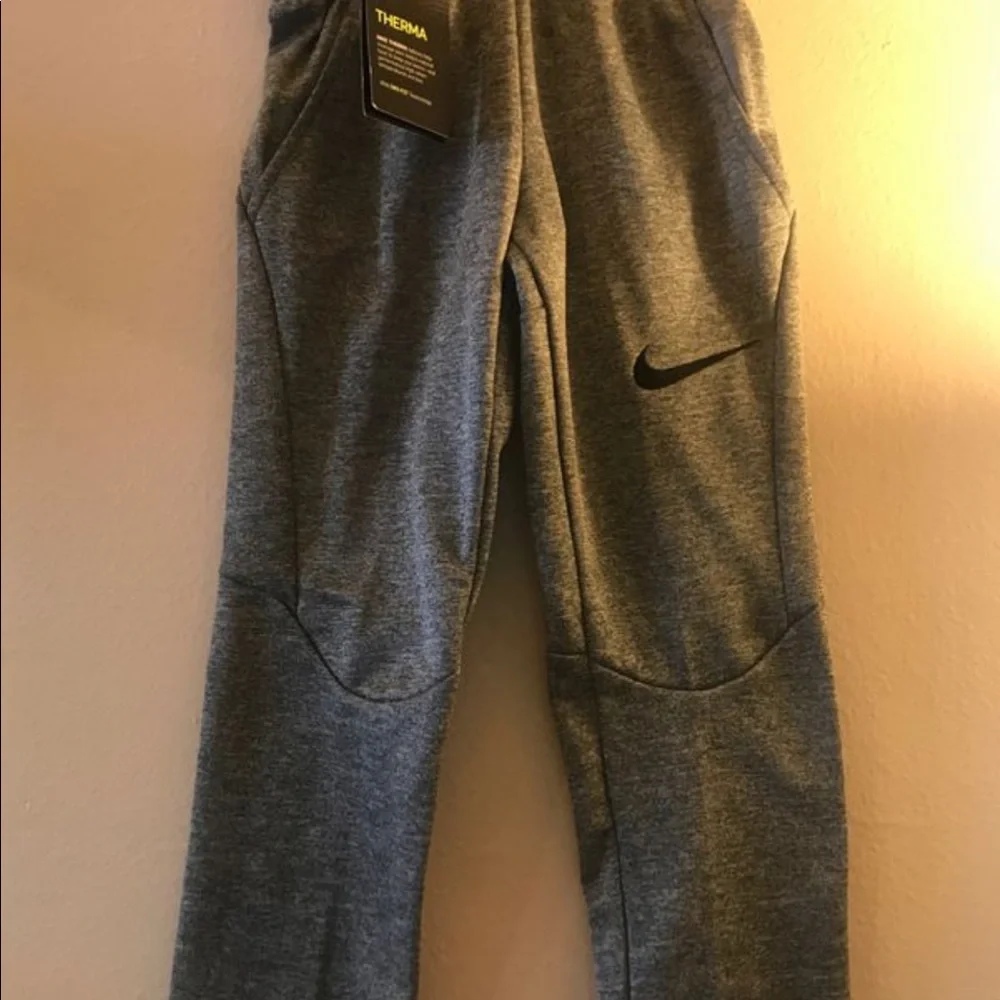 Nike Boys open Hem Therma Pants.