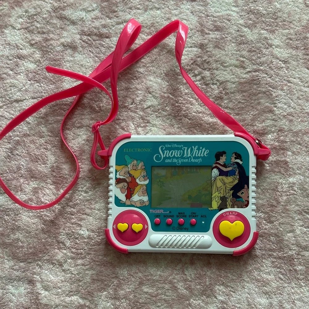 Vintage 1990 Tiger Electronics Snow White Handheld Game with purse strap