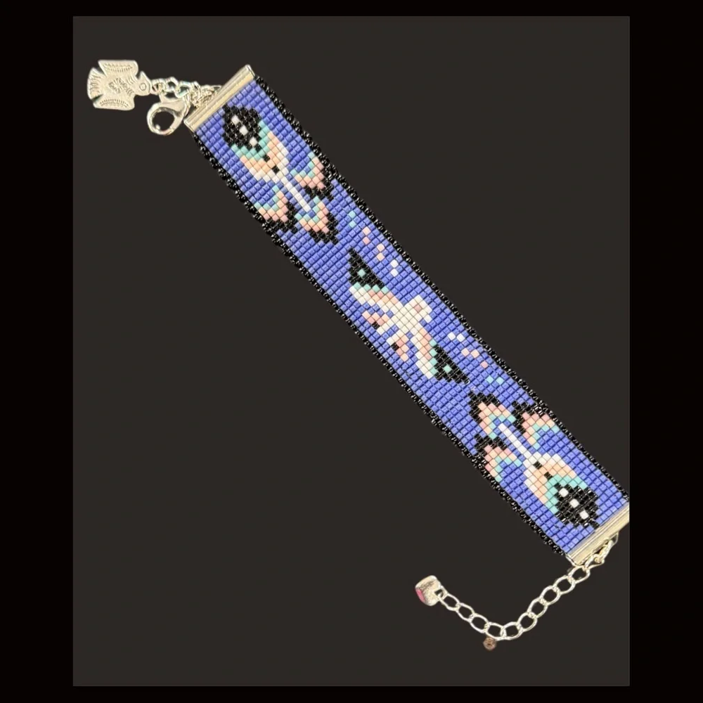 Hand crafted Adjustable Beaded Bracelet with Thunderbird and charms
