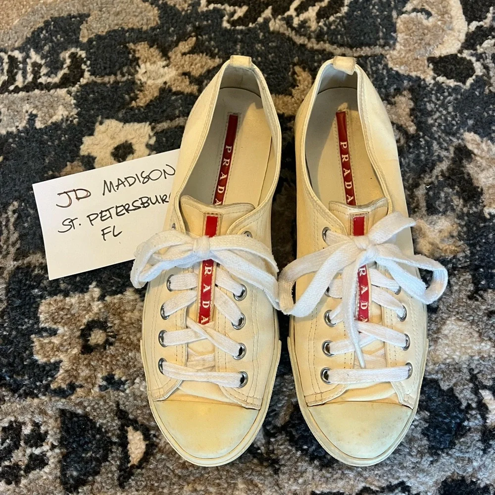 Prada questions leave
