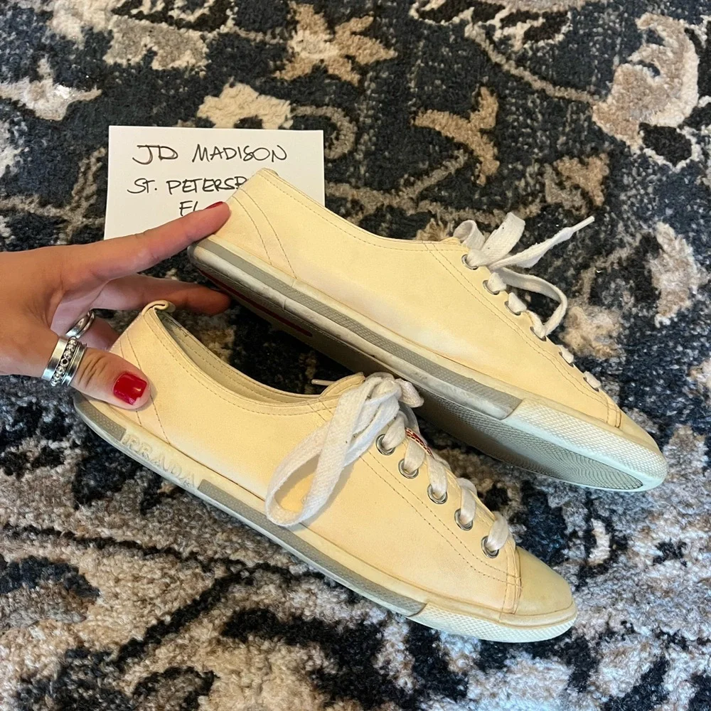 Prada questions leave