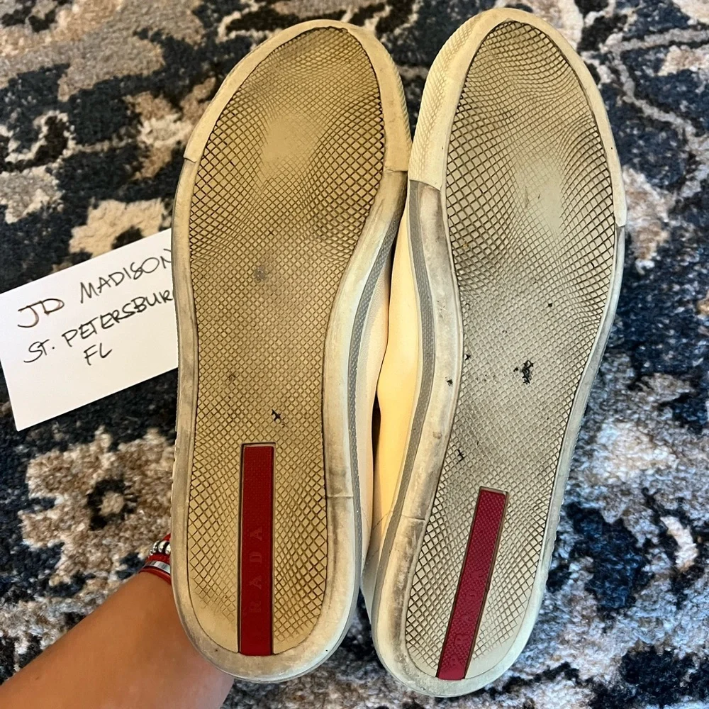 Prada questions leave