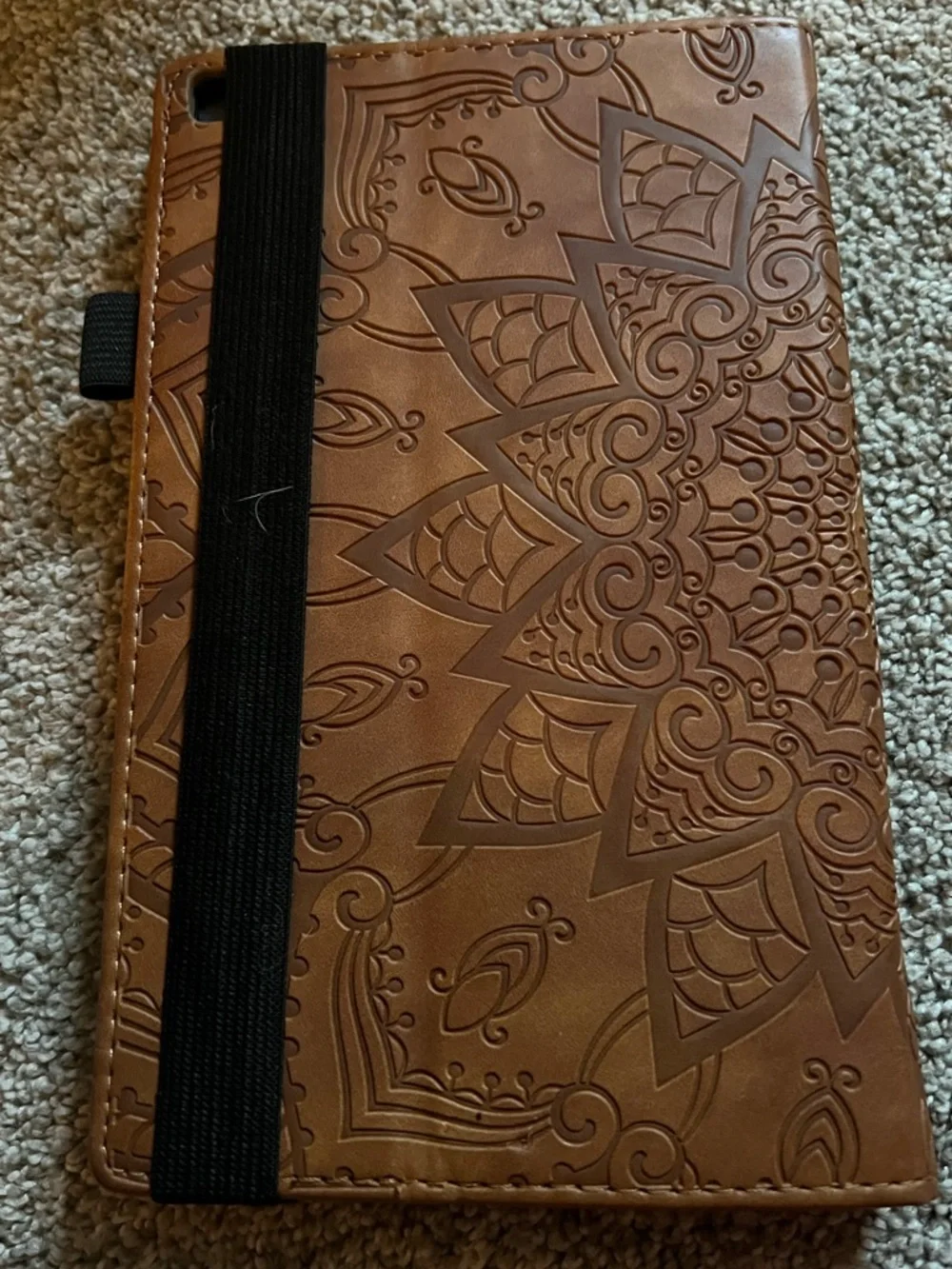 Tablet included with brown leather folio case