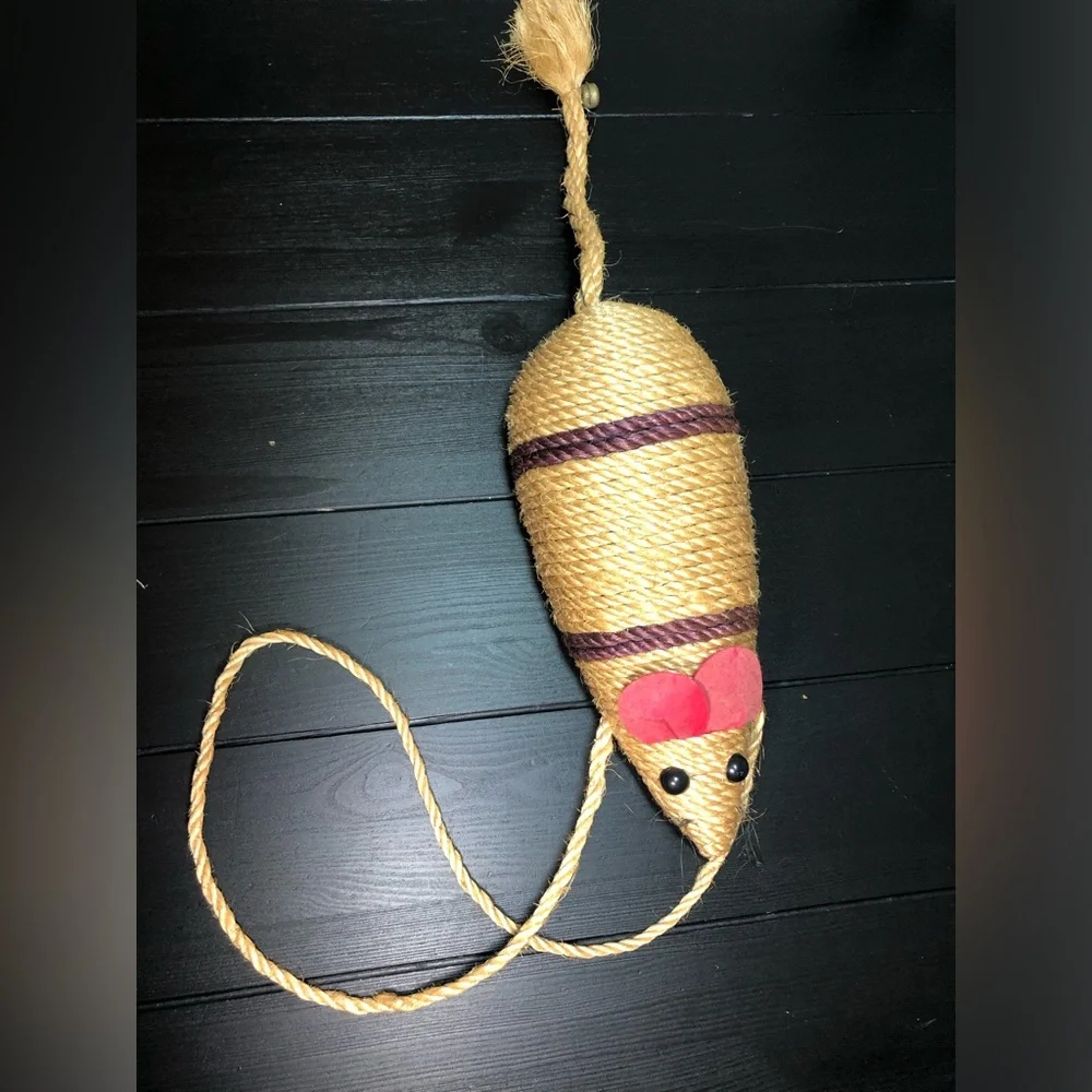 Decor toy mouse for a cat made of jute rope isolated.