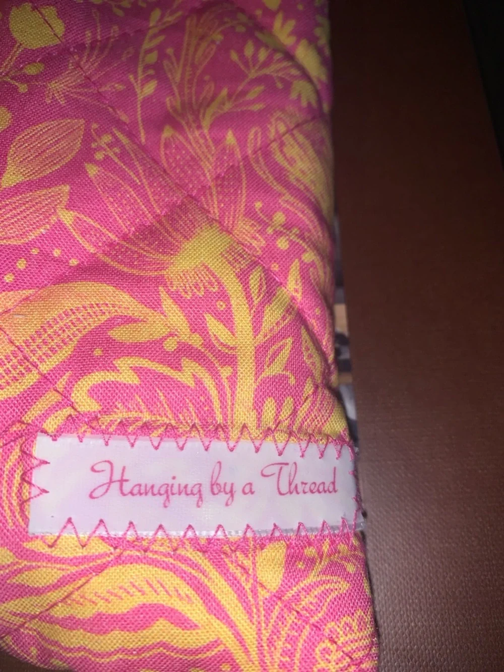Hanging by a Thread pink yellow