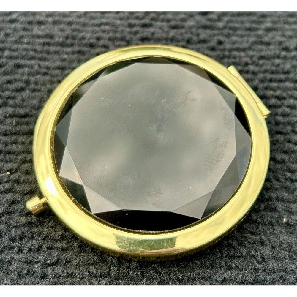 N/A gold compact