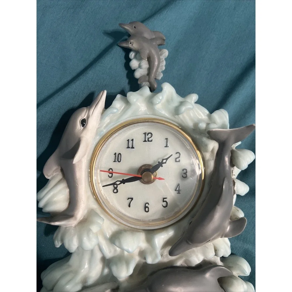 Source Unknown dolphin clock
