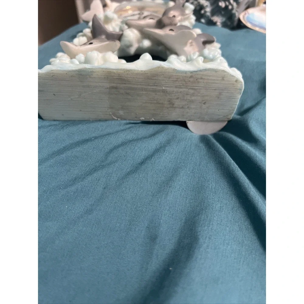 Source Unknown dolphin clock
