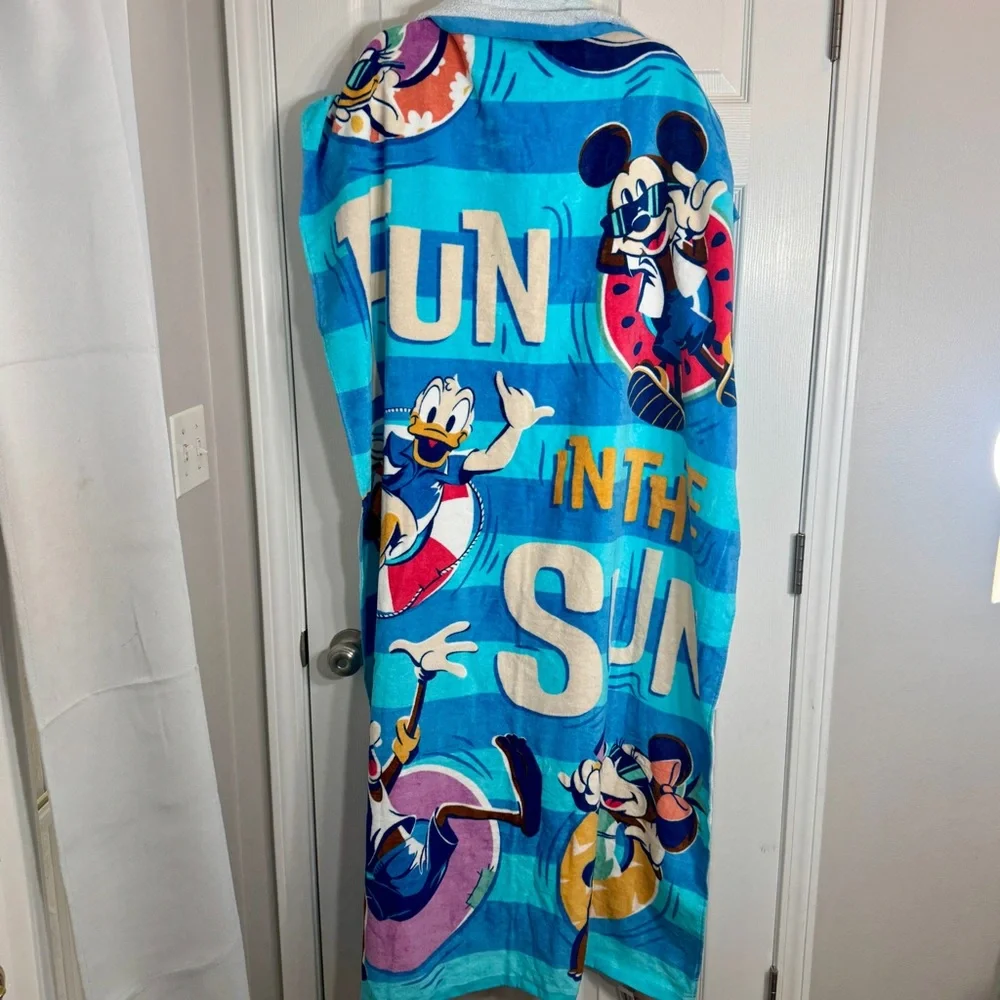 NWT. Disney beach towel featuring Mickey Mouse and others. “FUN IN THE SUN