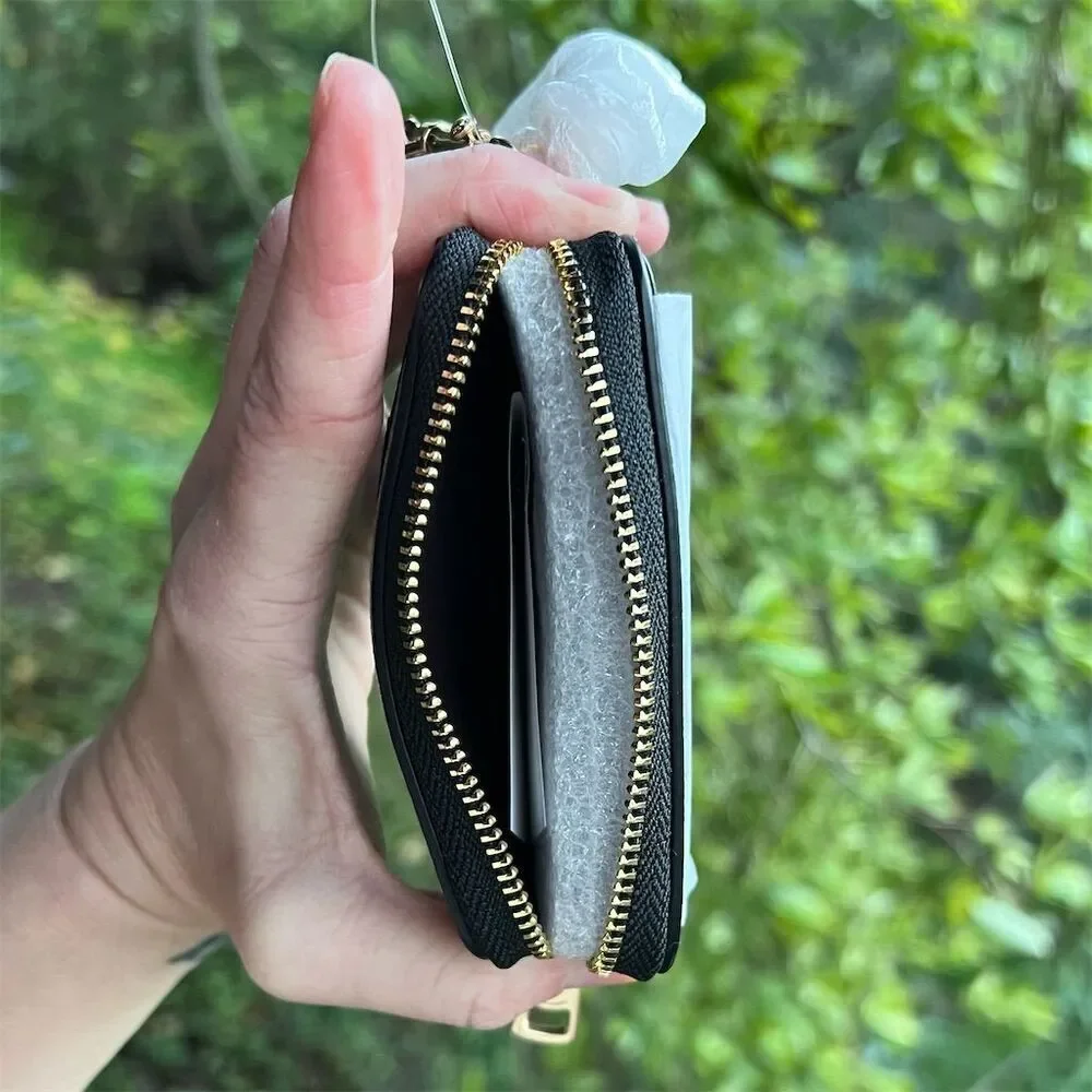 COACH women zip