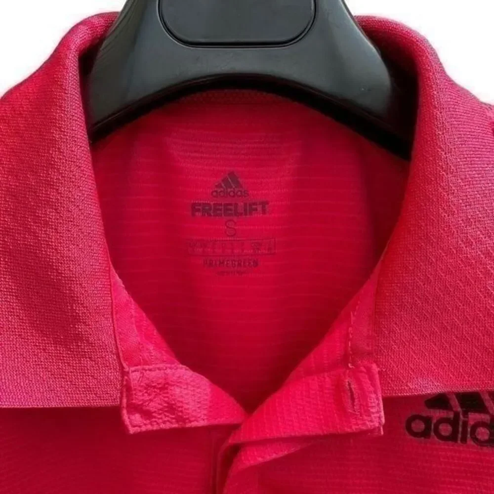 Adidas freelift polo color raspberry size S. A424