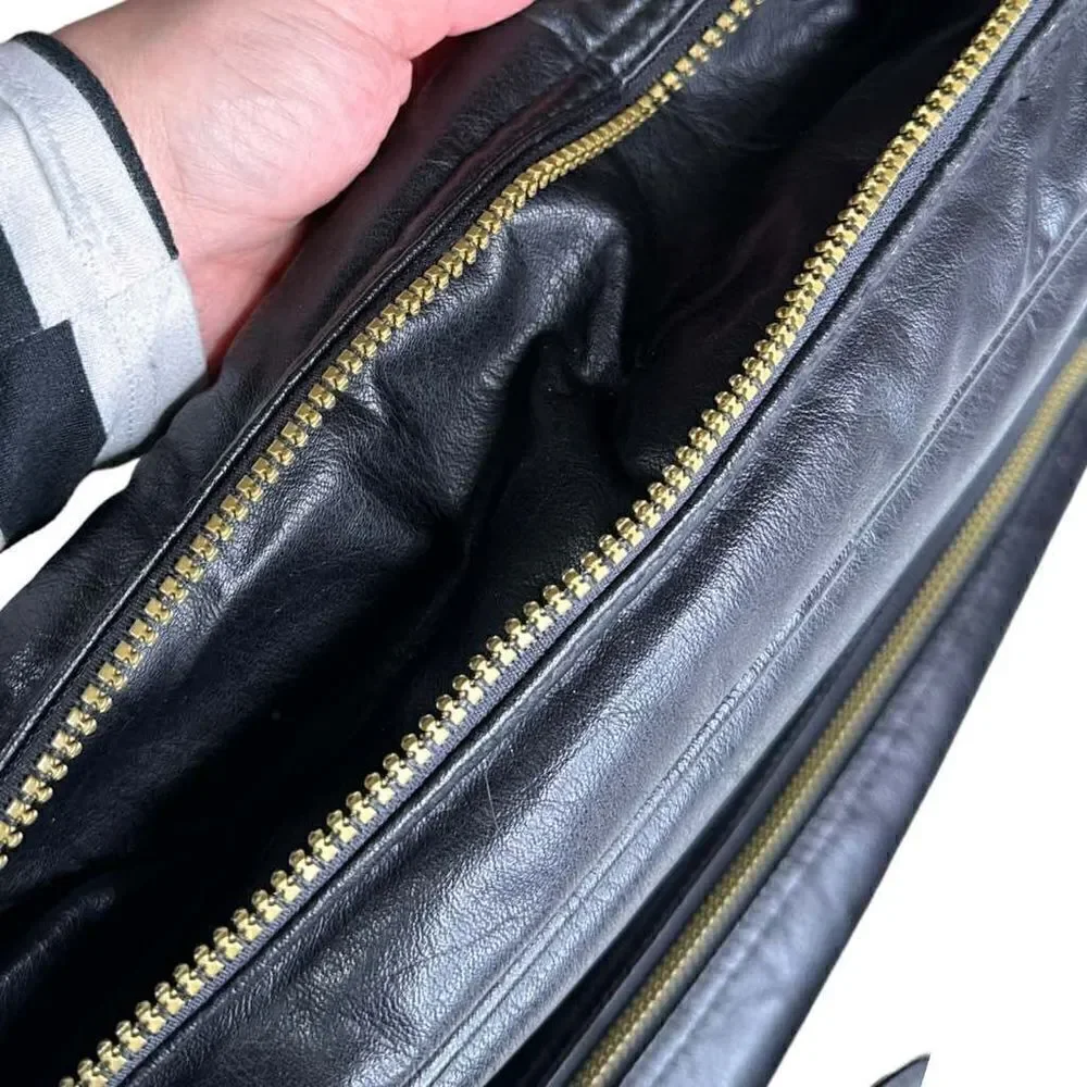 Large leather travel/work bag black with lots of pockets adjustable shoulder str