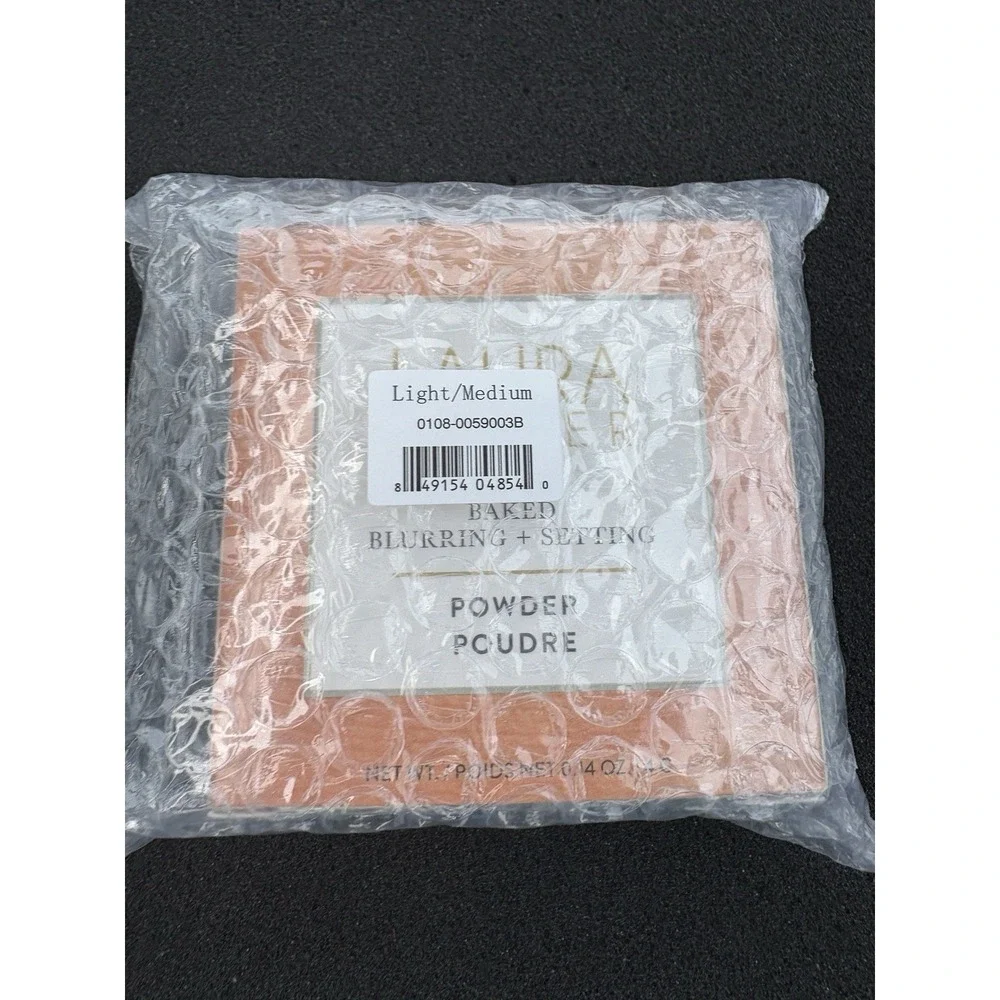 LAURA GELLER Baked Blurring + Setting Powder - LIGHT / MEDIUM  - .14  Sealed