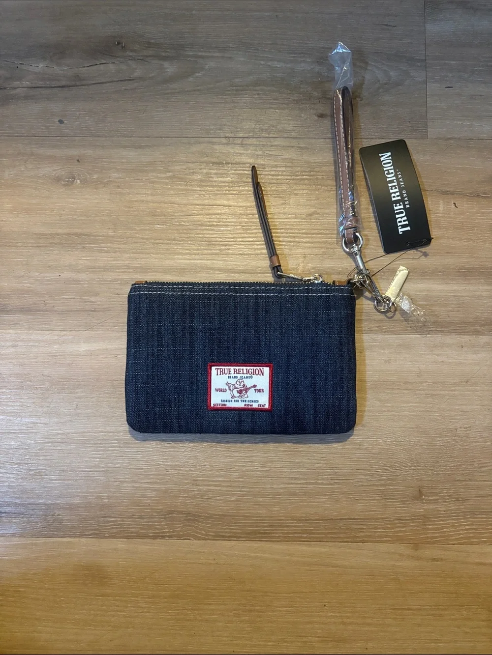 True Religion Dark Denim Wristlet with Brown Leather Strap