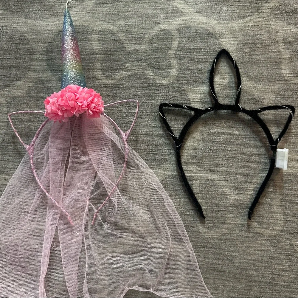 2 Unicorn hairbands. 1 with a veil the other lights up