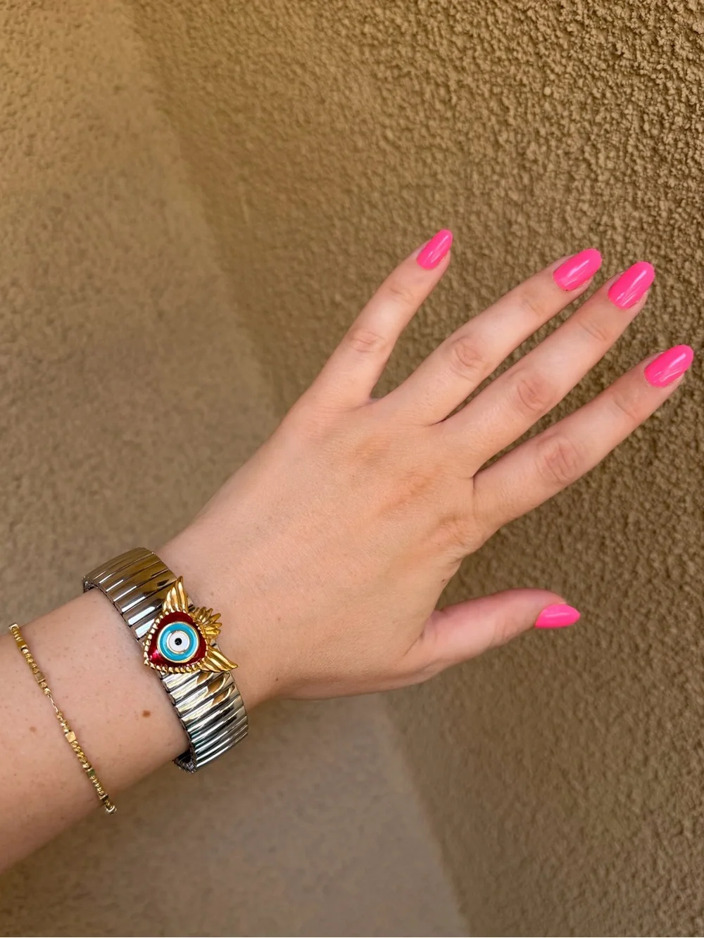 Silver Stretch Bracelet with Fish and Gold Red Evil Eye Accent