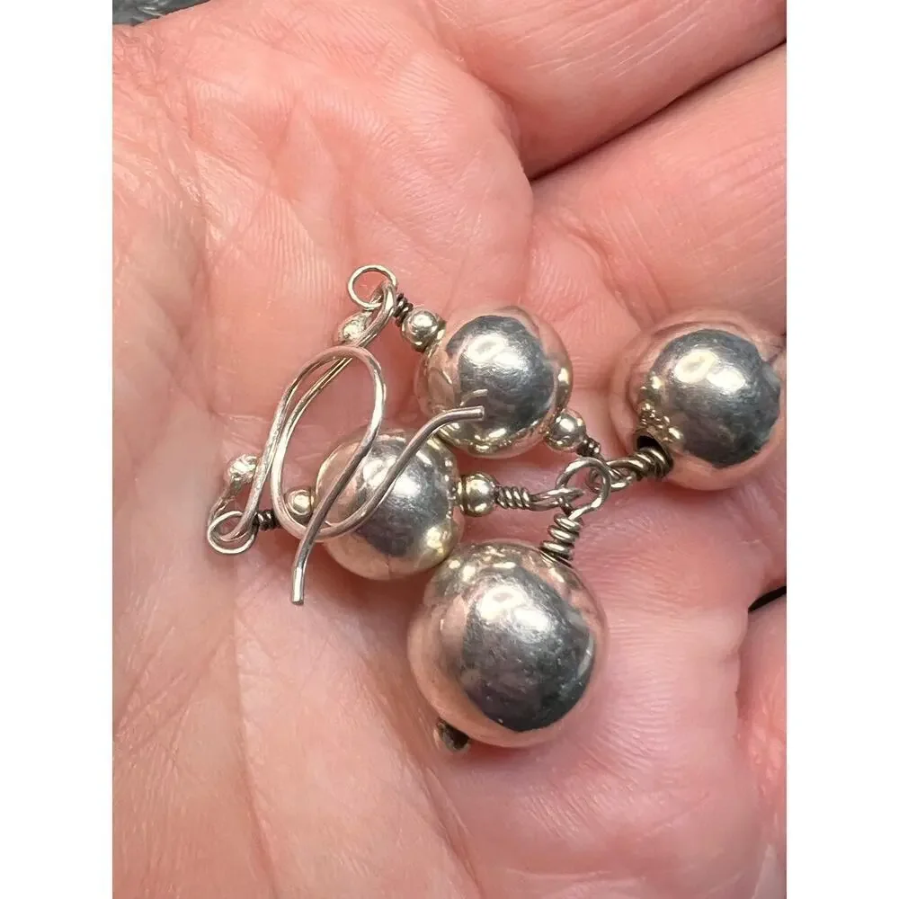 Vintage sterling silver graduated ball dangling earrings