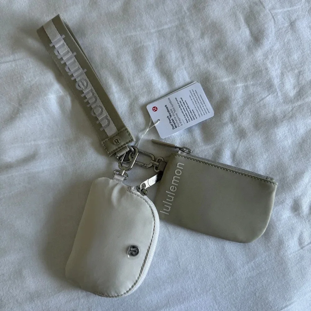 8 🆕 Lululemon Dual Pouch Wristlet Wordmark Raw Linen White Opal