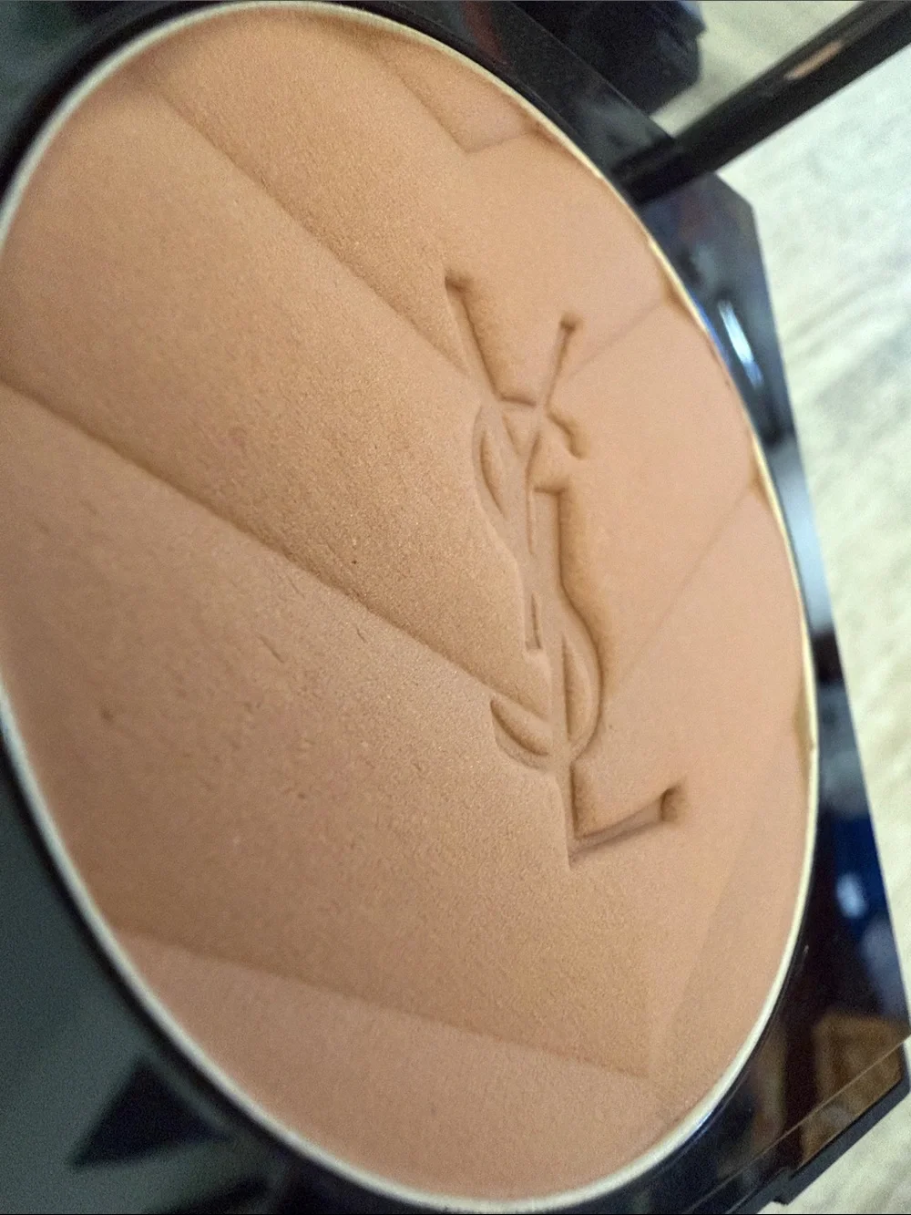 Yves Saint Laurent over logo