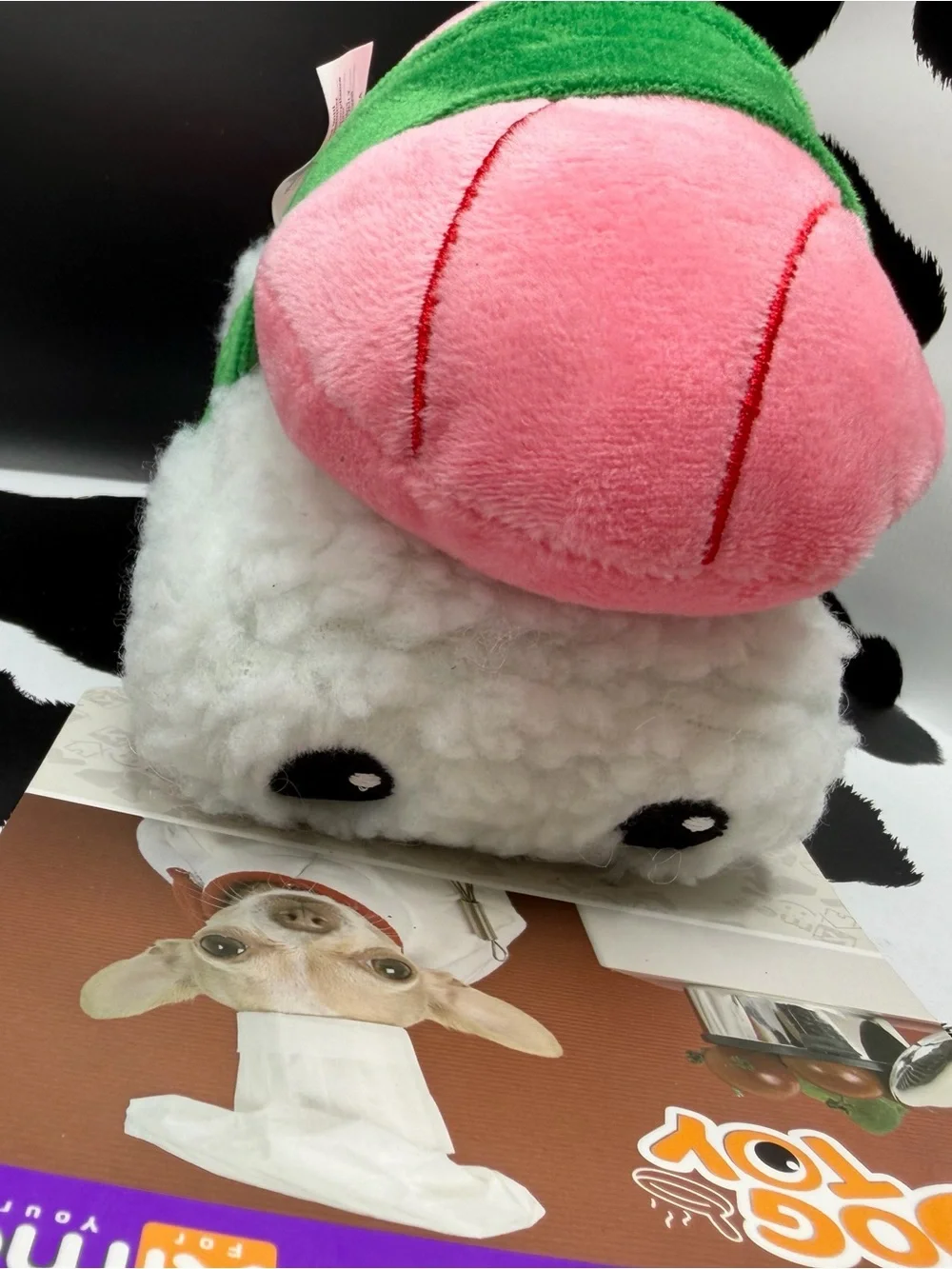 Kimee Pink Squeaky Plush Sushi Dog Toy with Green Band to Mimi’s seaweed
