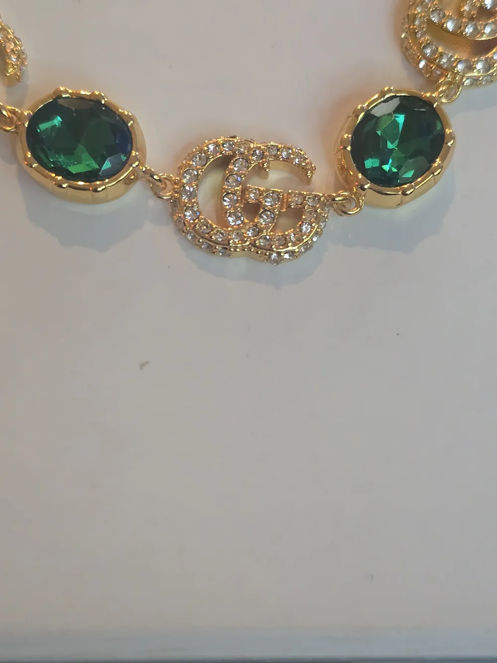 Gucci 18kgp GG Gold-Tone Bracelet with Emerald Green Crystal Accents