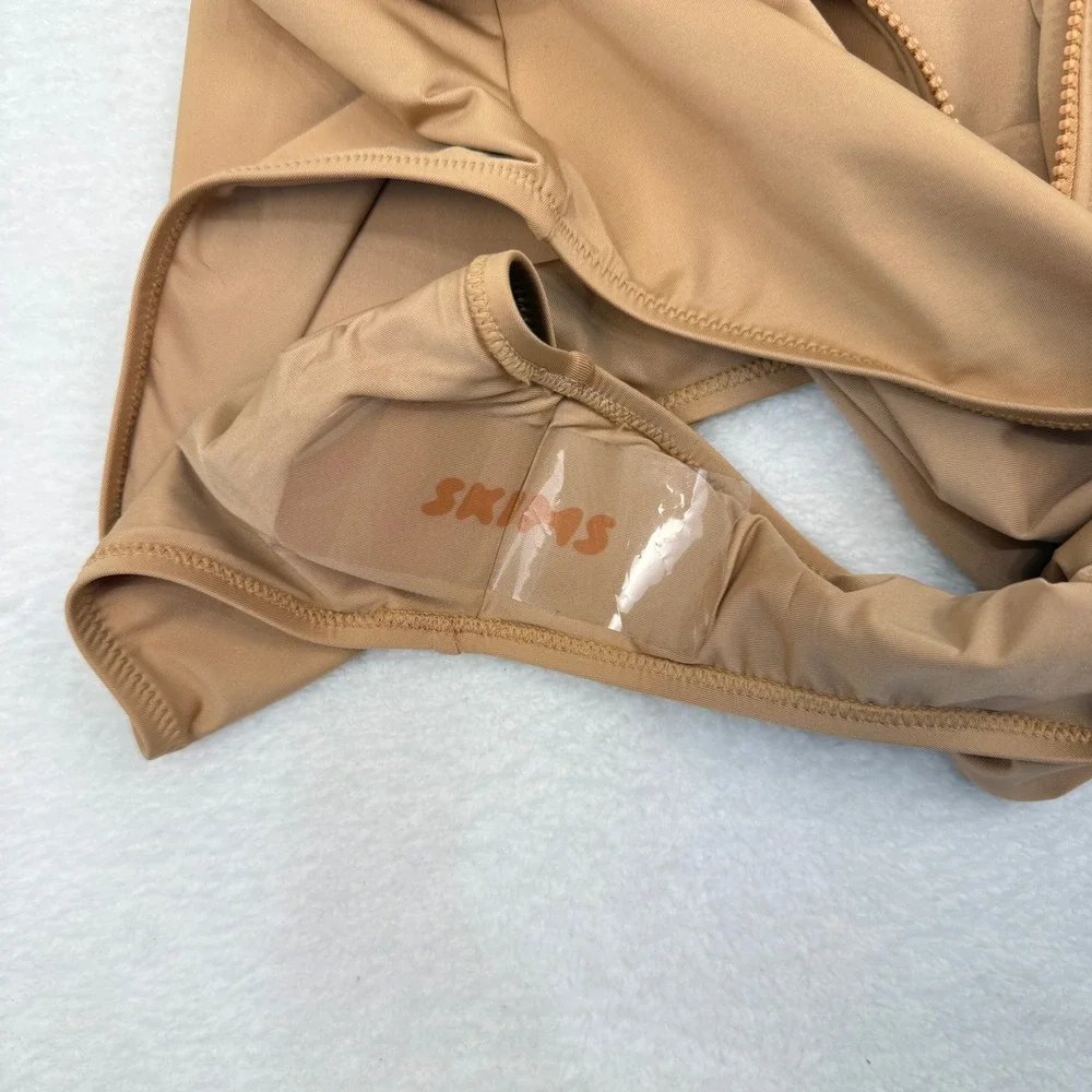 SKIMS tags intact