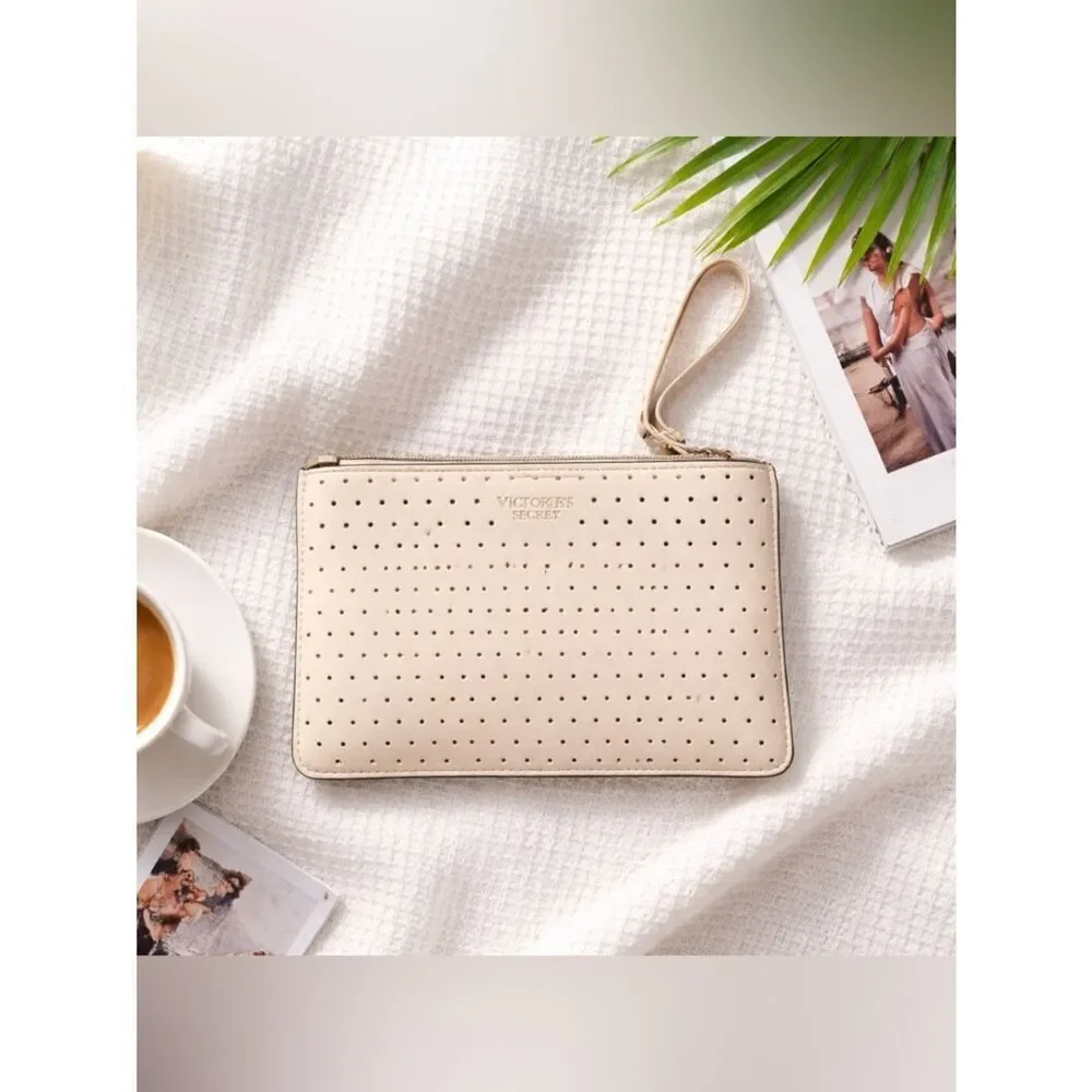 🛍️ Victoria's Secret Cream pinkish cut out Perforated zip Wristlet medium