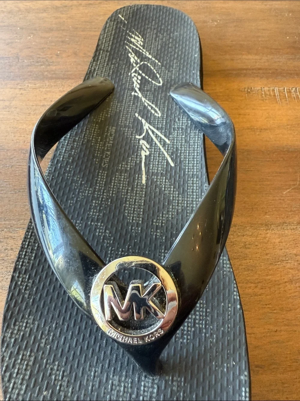 Michael Kors Black and Gold MK Logo Jelly Flip Flop Sandals
