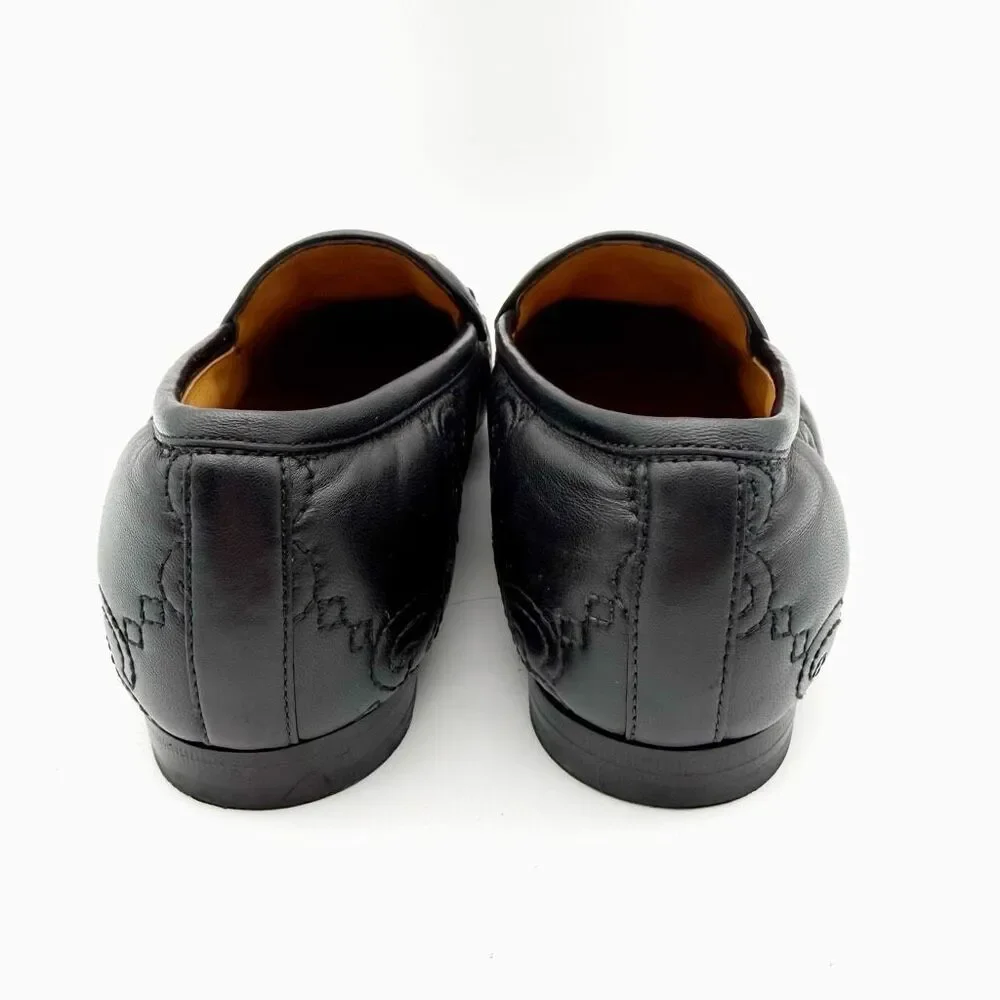 Gucci black embossed