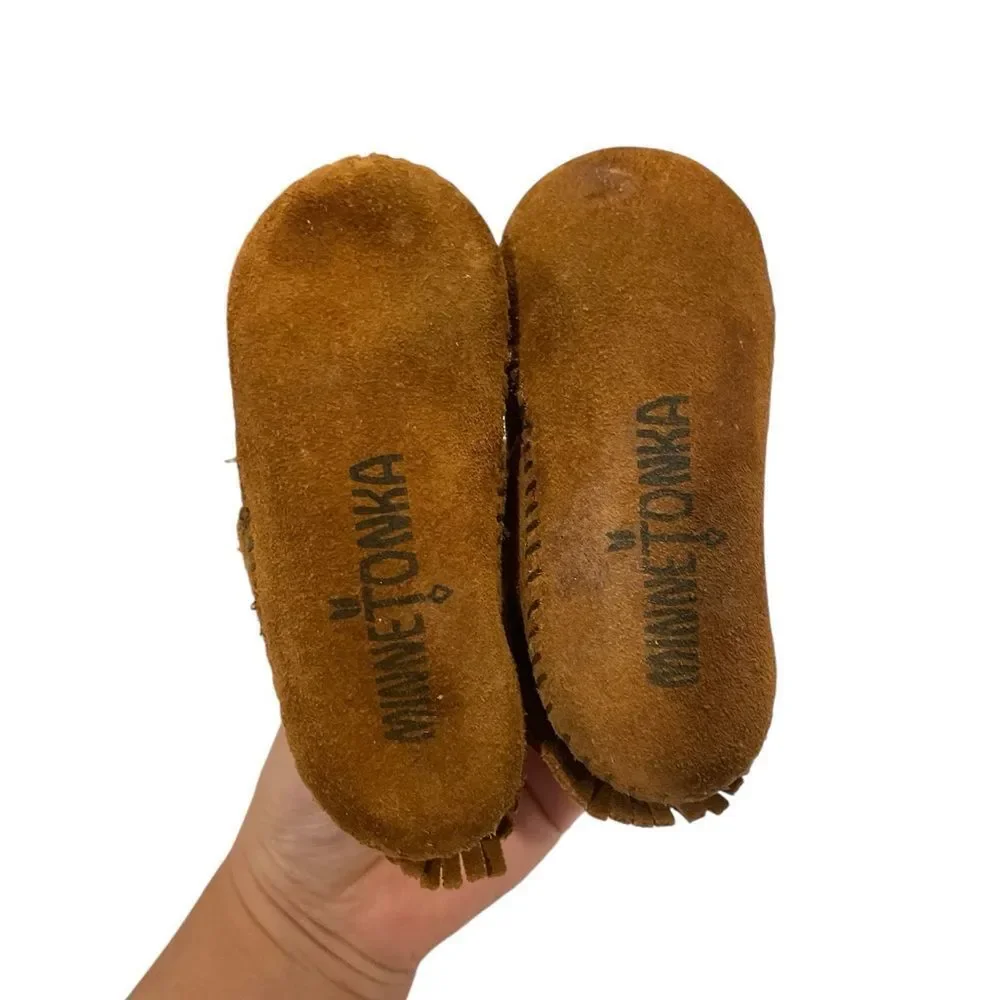 Minnetonka Tan  Moccasins with Fringe size 4