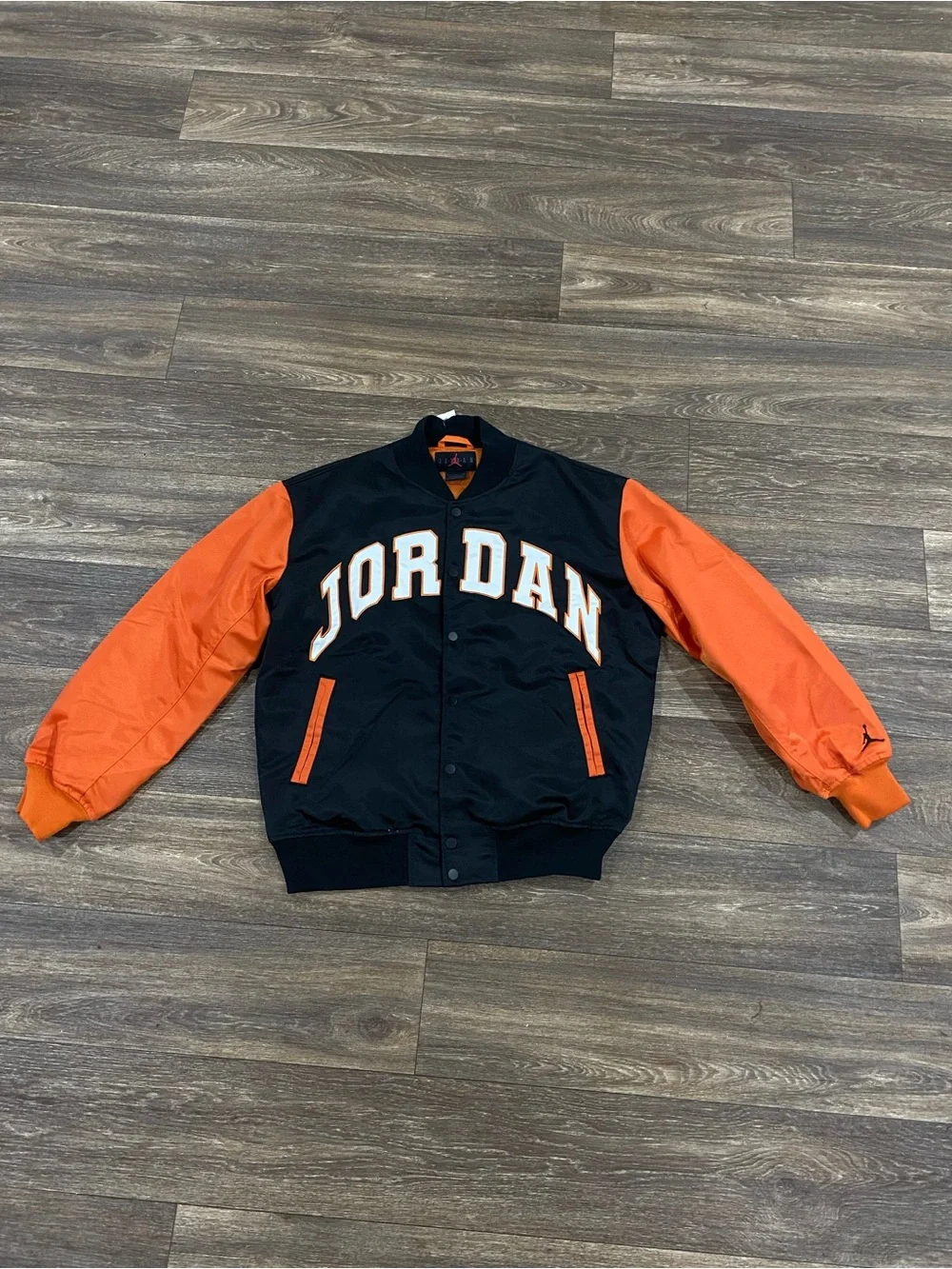 Jordan Black Jacket with White and Orange Lettering