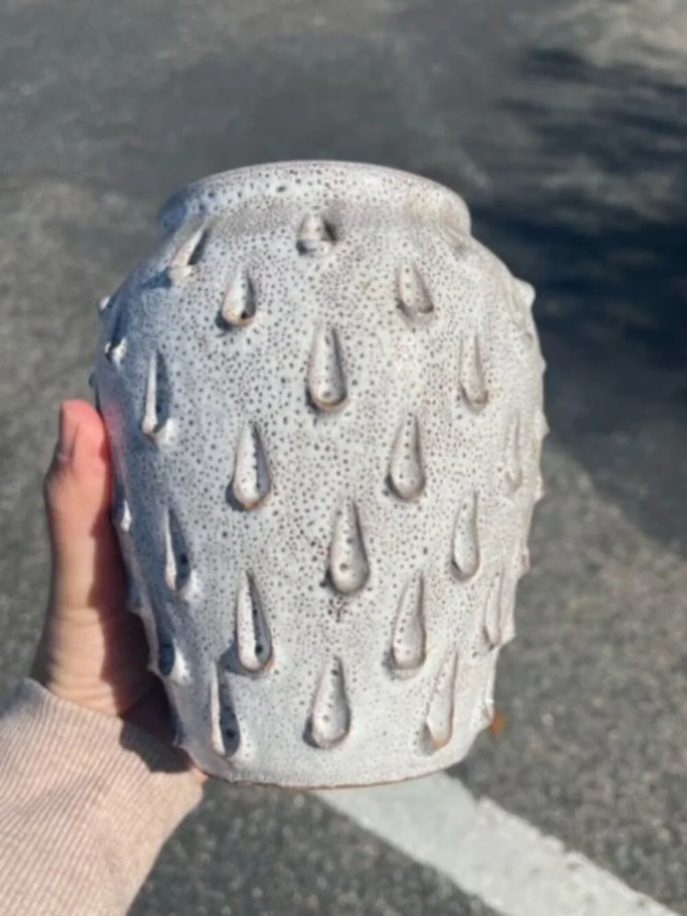 Ceramic vase with white speckled teardrop-shaped patterns