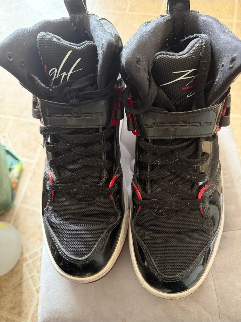 Jordan Black High-Top Sneakers with Red Highlights