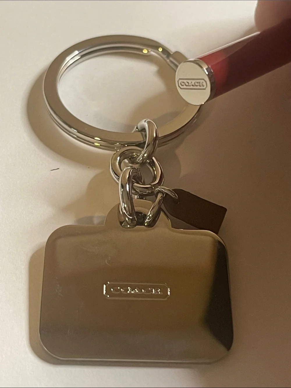 Coach metal charm