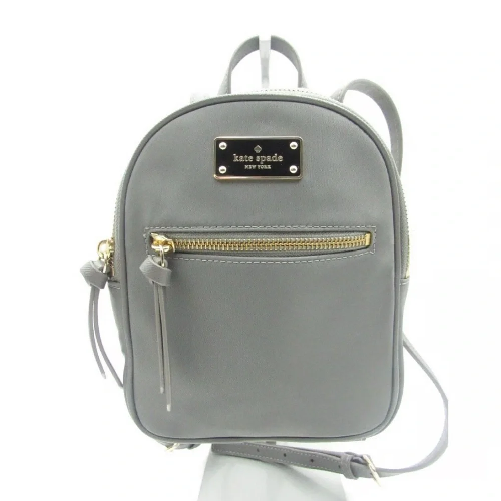 Kate Spade New York Mini Bradley nylon backpack in gray with gold zippers
