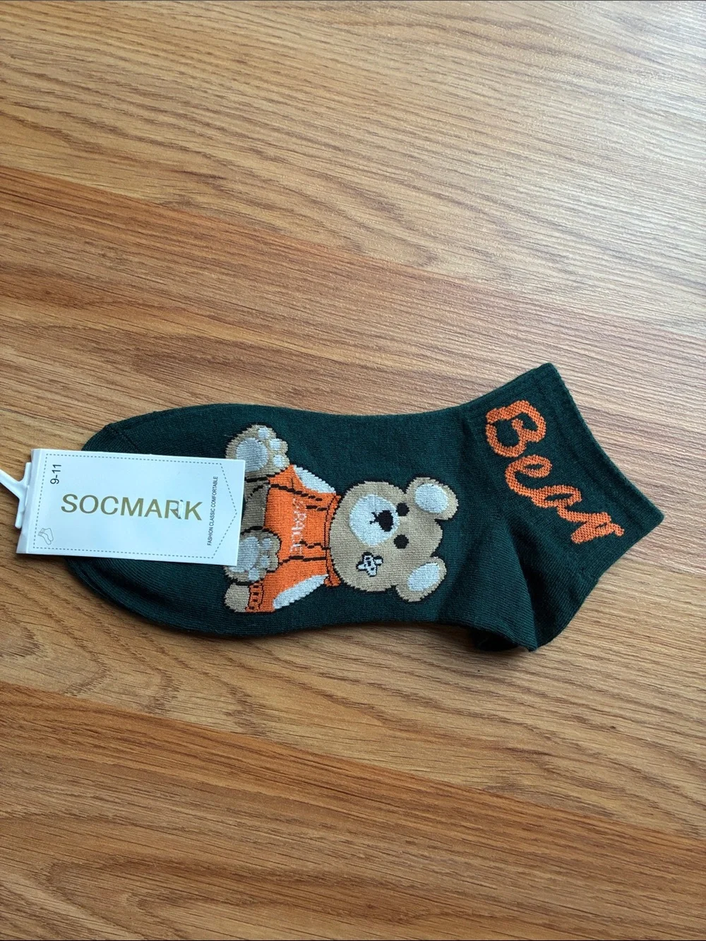 mark. Dark Green Socks with Orange Bear Accent
