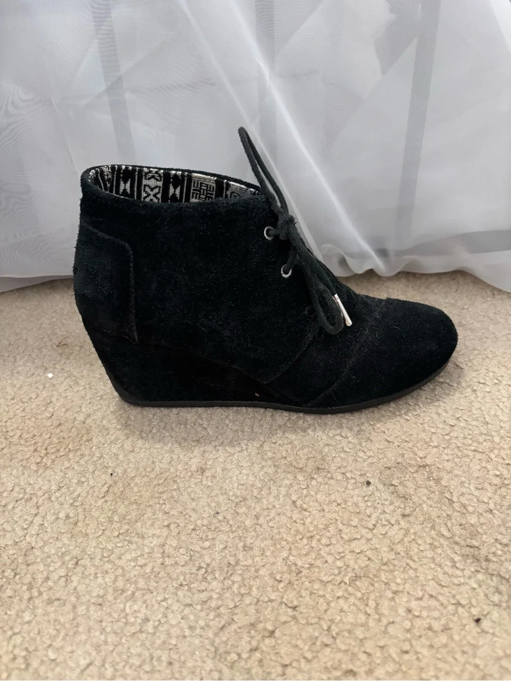 Toms has white wedge