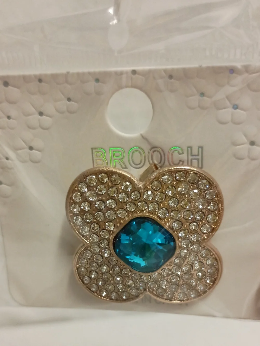 Gold Tone Rhinestone Flower Brooch Pin with Iridescent Crystal Center Blue