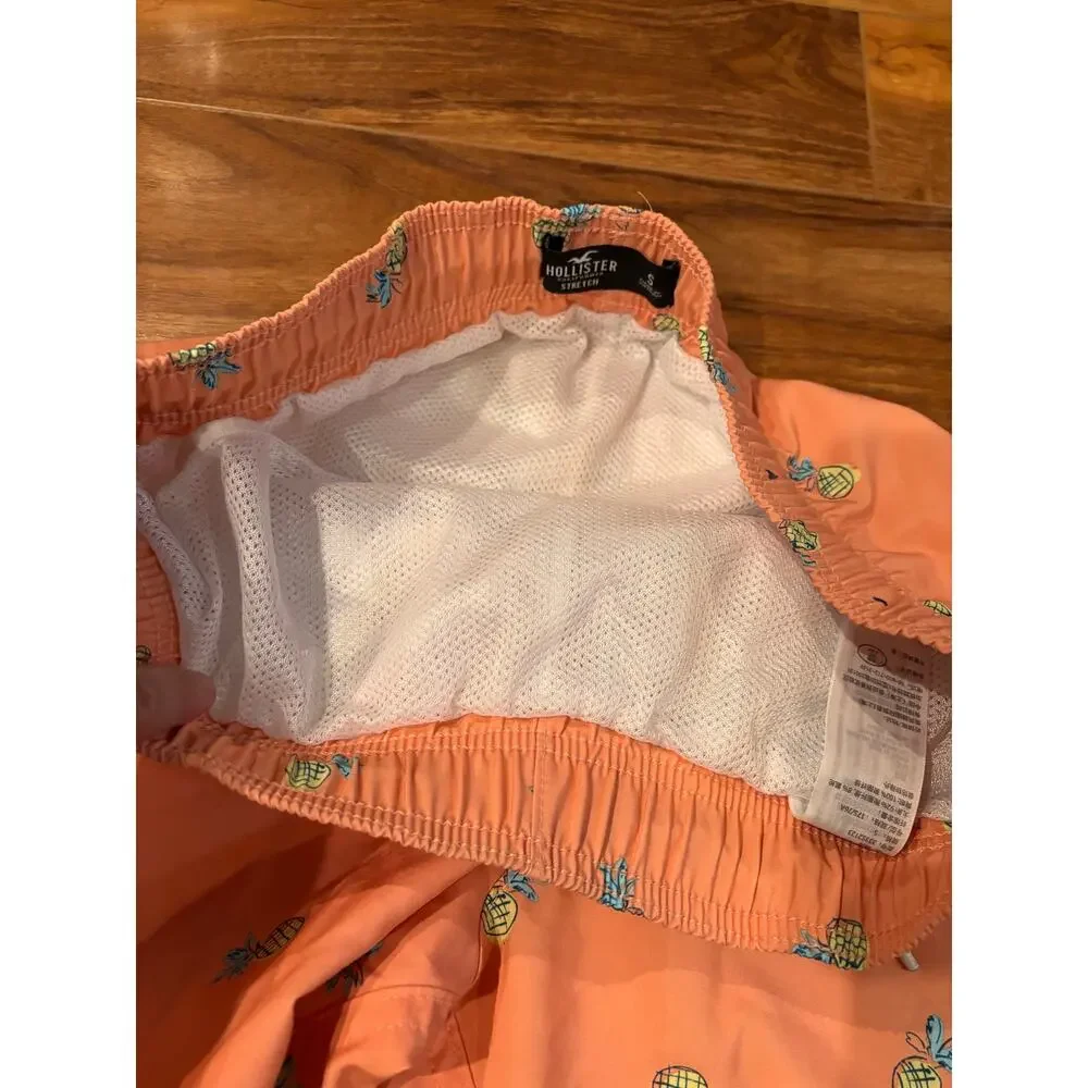 Hollister men’s small mesh lined swim trunks orange with yellow pineapples