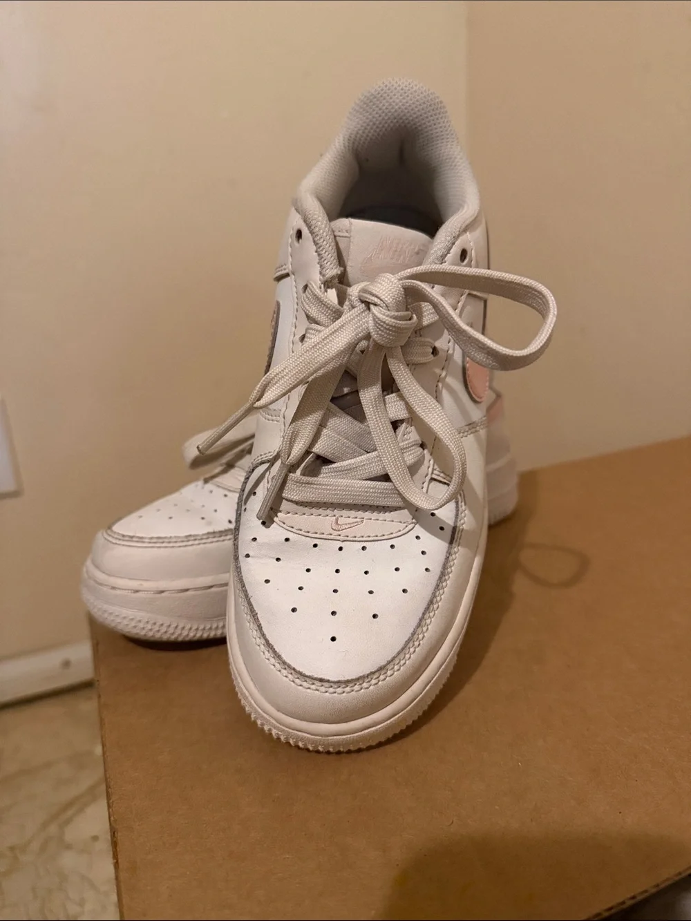Nike White Low-Top Sneakers with Pink Swoosh