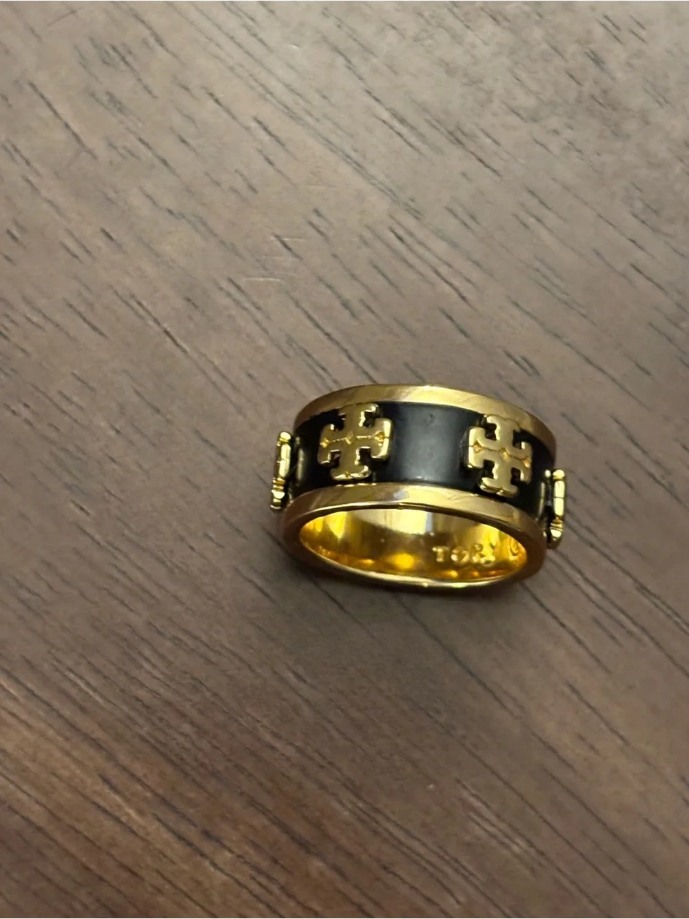 Tory Burch logos polished