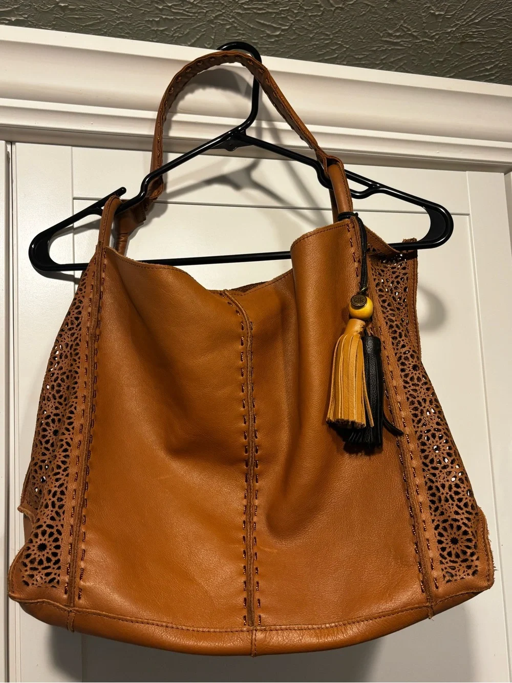 The Sak Laser-Cut Leather Hobo in Cognac