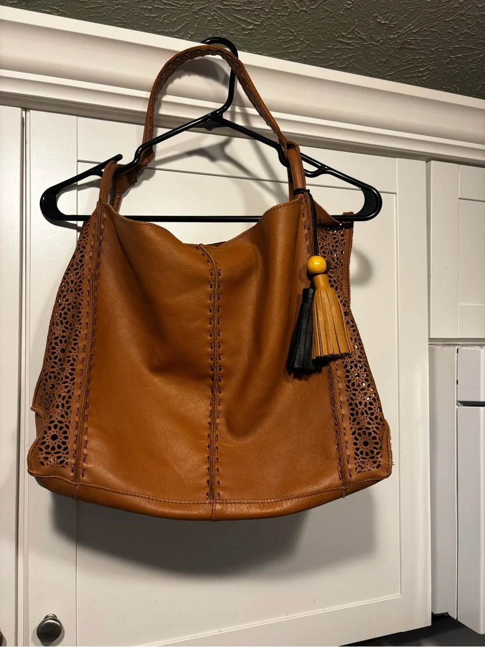 The Sak Laser-Cut Leather Hobo in Cognac