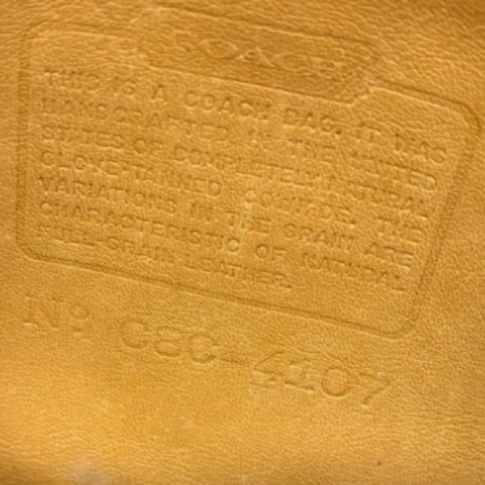 Coach scuff wear