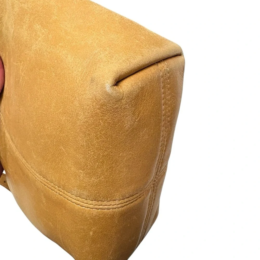 Coach scuff wear