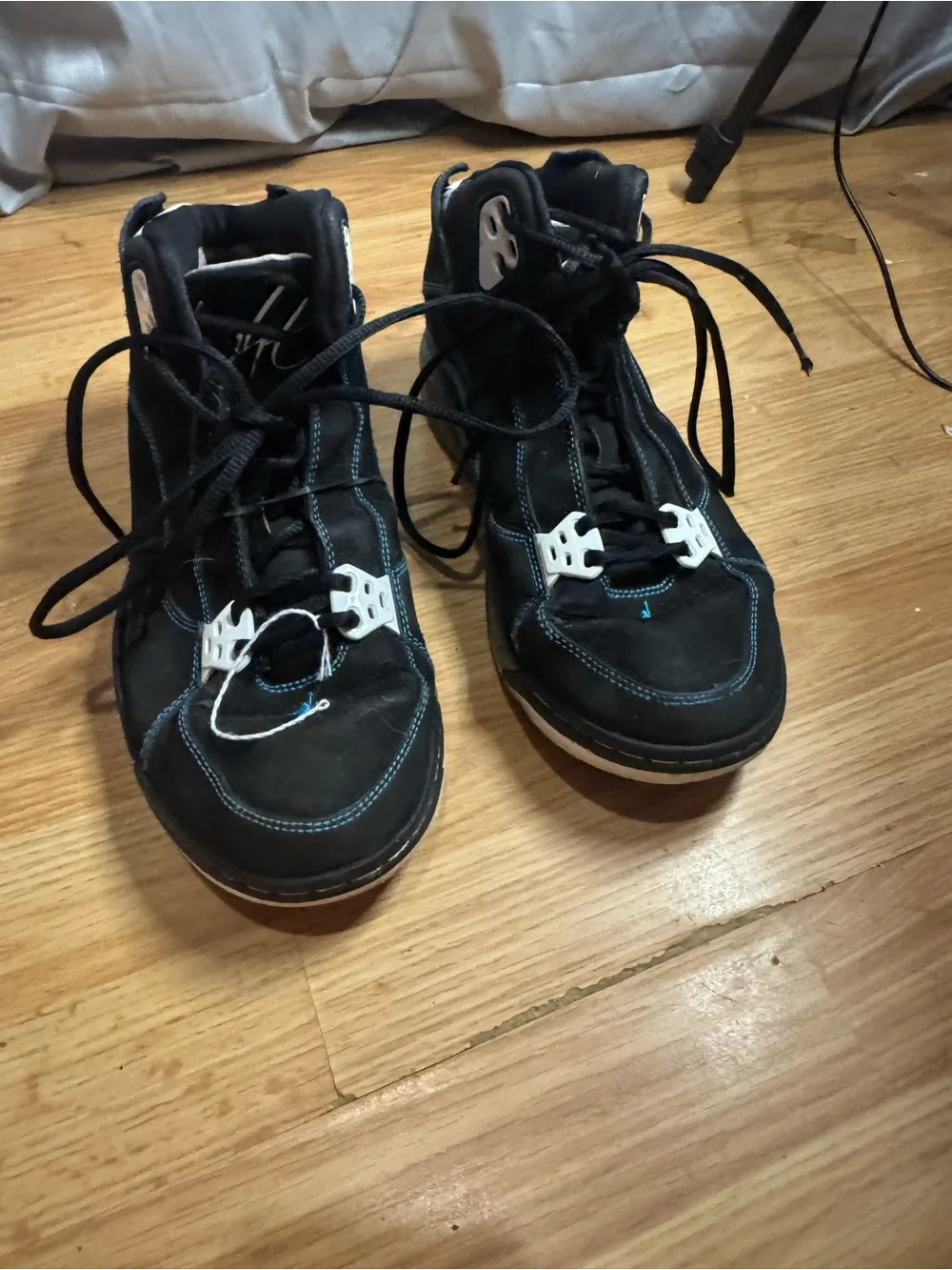 Jordan Men's Black High-Top Sneakers with White Eyelets and Blue Stitching