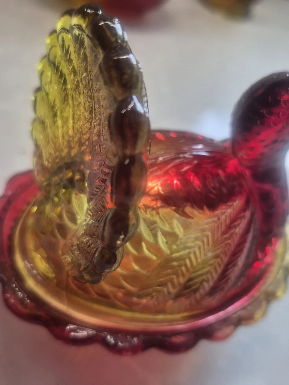 Hen On Basket. Carnival Glass Decorative Dish in Amber to Ruby Iridescent